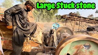 “Man Removes Large Stuck Stone with Hydraulic Jaw Crusher” crushing jawcrusher [upl. by Steffie]