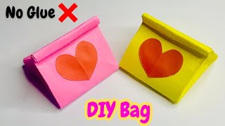 Origami paper bagHow to make paper bag without glueno glue craftDIYSchool projectHow to make [upl. by Idnahc]