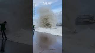 Huge wave wipes out man as Storm Ciaran hits [upl. by Ainet]