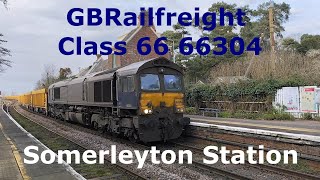 Class 66 GBRf 66304 Network Rail Ballast Train passing through rural Somerleyton Railway Station [upl. by Alrrats]