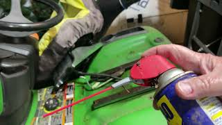 How To Fix a John Deere X320 Lawn Tractor Frozen Seat thats Stuck and Will Not Move [upl. by Jonah940]