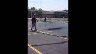 Dual spray tip asphalt sealcoating wand Michigan style parking lot sealing [upl. by Northrop504]