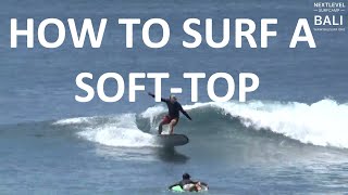 How to Surf a Softtop Surfboard at Padang Padang  NextLevel Surfcamp Bali expression session [upl. by Anirdnajela]