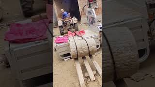 Grain crushing round stone loading process [upl. by Lyrred]