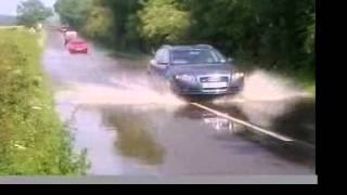 Cars tackle flooded roads [upl. by Naryt]