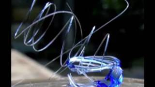 Melting Glass with the sun n Fresnel Lens to make glass springs with sun power [upl. by Evadnee]