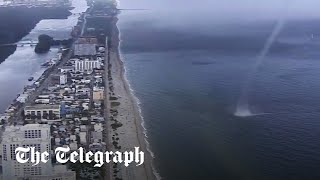 Waterspout crashes on to beach full of people in Miami Florida [upl. by Hsu352]