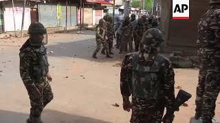 Kashmiri protesters and Indian security forces trade stones and tear gas [upl. by Eltsyrc]