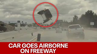 Tire pops off truck flips car on California freeway [upl. by Valdes]