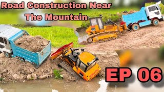 The contractor has formed the road near the mountain next to the river EP 06 excavotor truck car [upl. by Adnanref]