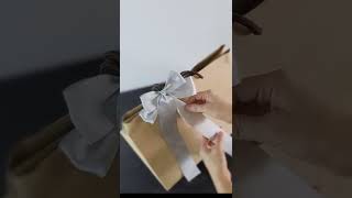 How to tie ribbon on gift Bag Shorts [upl. by Nnylirehs]