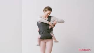 How to place your child on your back in BABYBJÖRN Baby Carrier One – tutorial [upl. by Norahs97]