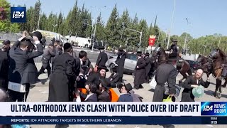 UltraOrthodox Jews riot outside of main IDF drafting center [upl. by Ahsiemal313]