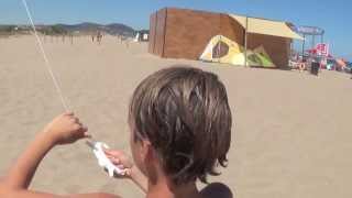 Kids Flying Kites on Beach at Playa Brava in Spain [upl. by Ahsekyt33]