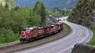 Train Follows Curvature Of Highway Thru Canadas Canyon CP SD70ACU Rebuild In Action [upl. by Agathy294]