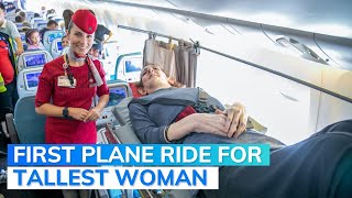 Worlds Tallest Woman Boards Flight For First Time [upl. by Helene]