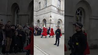 Security officer protecting Royal Guard from front shorts royalguards horseguardsparade london [upl. by Nauqed]