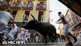 Watch Thousands take part in the running of the bulls in northern Spain [upl. by Kimbell]