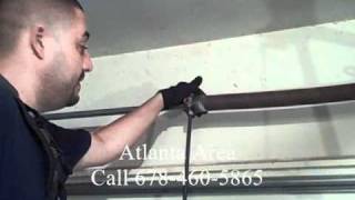 Garage Door Torsion Spring Repair  DIY Dangers Of Removing Torsion Springs [upl. by Tedda]