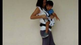 Manduca Baby Carrier Instructions  Switching from Side Carry to Front Carry Position [upl. by Atkins871]