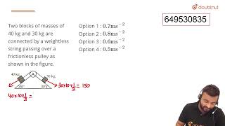 Two blocks of masses of 40 kg and 30 kg are connected by a weightless string passing over a fric [upl. by Savell]