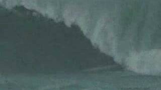 Surfer Surfs a Tsunami  brave or stupid you decide [upl. by Hubble]