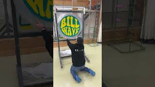 Man is tufting a custom rug with the logo for Bill Wave [upl. by Freyah]